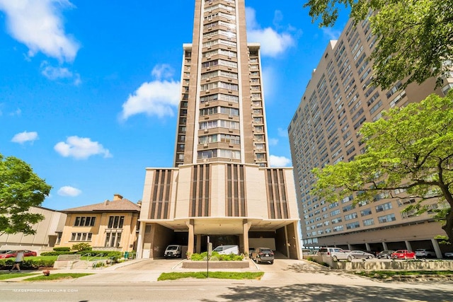 6325 N Sheridan Rd Unit 1903, Chicago, IL 60660 - view of building exterior featuring a carport and concrete driveway