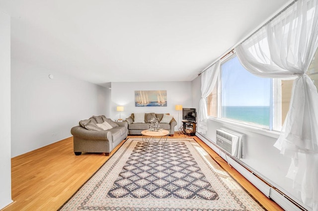 6325 N Sheridan Rd Unit 1903, Chicago, IL 60660 - living area with wood finished floors, a baseboard heating unit, and a wall mounted AC