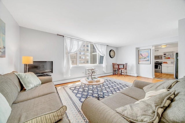 6325 N Sheridan Rd Unit 1903, Chicago, IL 60660 - living room featuring light wood finished floors, baseboard heating, and a baseboard heating unit