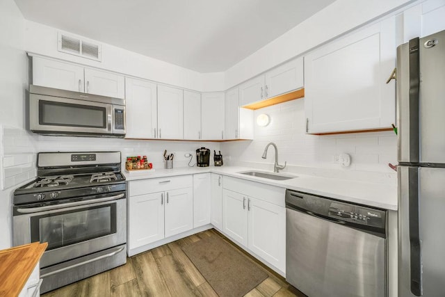 6325 N Sheridan Rd Unit 1903, Chicago, IL 60660 - kitchen with appliances with stainless steel finishes, light countertops, and white cabinets