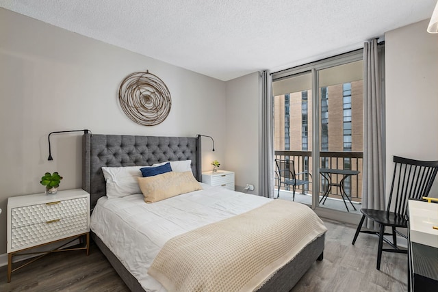222 N Columbus Dr Unit 2204, Chicago, IL 60601 - bedroom featuring wood finished floors, a textured ceiling, and a wall of windows