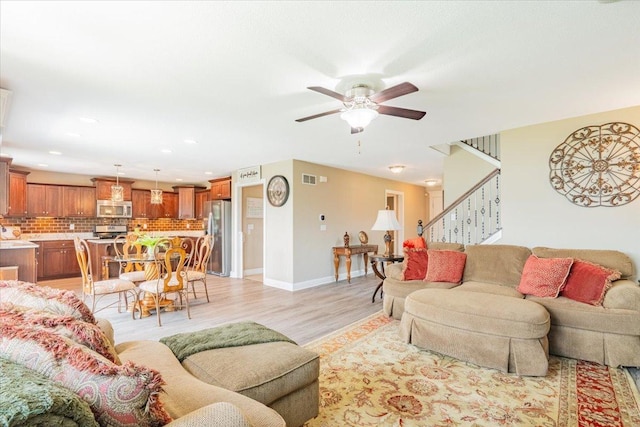 5108 Longfield Rd, Bloomington, IL 61705 - living area with light wood-style flooring, ceiling fan, stairs, and recessed lighting