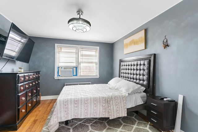 2204 S 9th Ave Unit 2, Broadview, IL 60155 - bedroom featuring radiator heating unit, hardwood / wood-style floors, and cooling unit