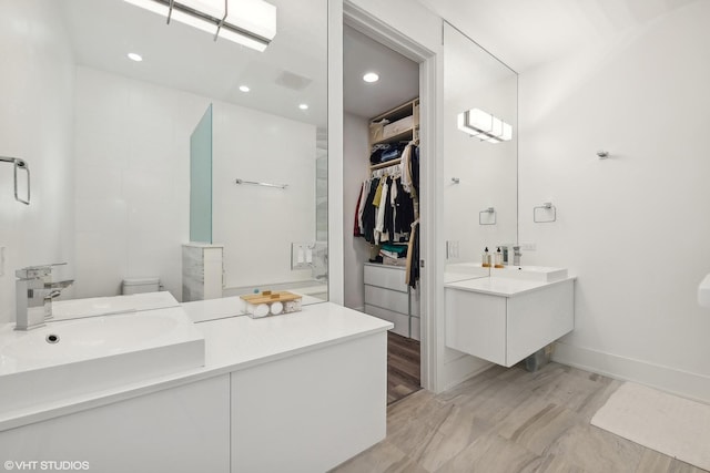 2814 W N Ave Unit 2W, Chicago, IL 60647 - bathroom featuring vanity, recessed lighting, a spacious closet, and walk in shower