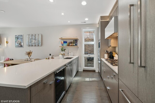 2814 W N Ave Unit 2W, Chicago, IL 60647 - kitchen featuring wine cooler, custom range hood, open shelves, a peninsula, and light countertops