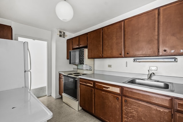 5455 N Sheridan Rd Unit 3203, Chicago, IL 60640 - kitchen with white appliances, light floors, and light countertops