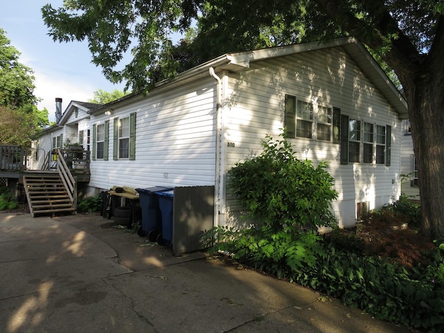 510 7th St, Mazon, IL 60444 - view of property exterior with a deck and stairway