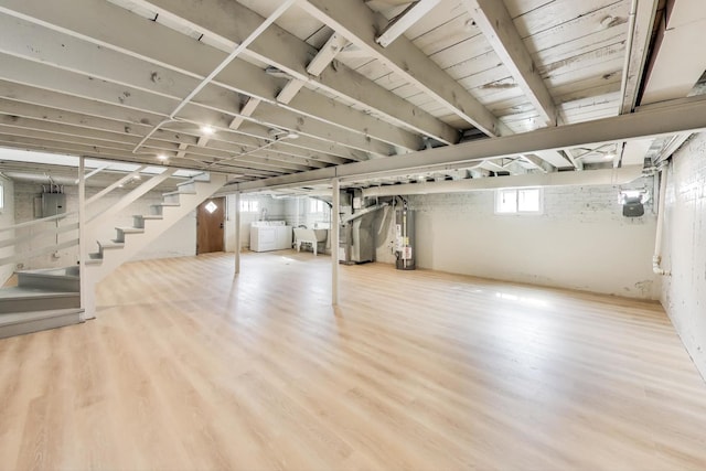 5949 W 55th St, Chicago, IL 60638 - below grade area with water heater, stairway, wood finished floors, and heating unit