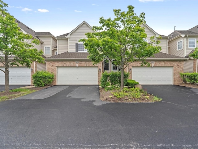 6079 Delaney Dr, Hoffman Estates, IL 60192 - view of front of property featuring driveway, brick siding, and a shingled roof