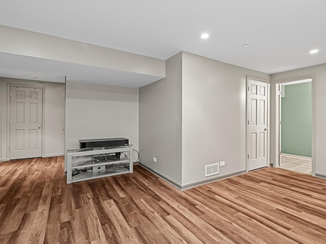 6079 Delaney Dr, Hoffman Estates, IL 60192 - unfurnished living room featuring wood finished floors and recessed lighting
