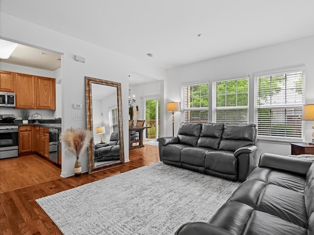 6079 Delaney Dr, Hoffman Estates, IL 60192 - living area featuring wood finished floors and a chandelier