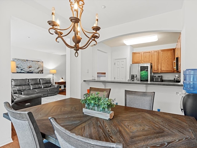 6079 Delaney Dr, Hoffman Estates, IL 60192 - dining space featuring arched walkways and a chandelier