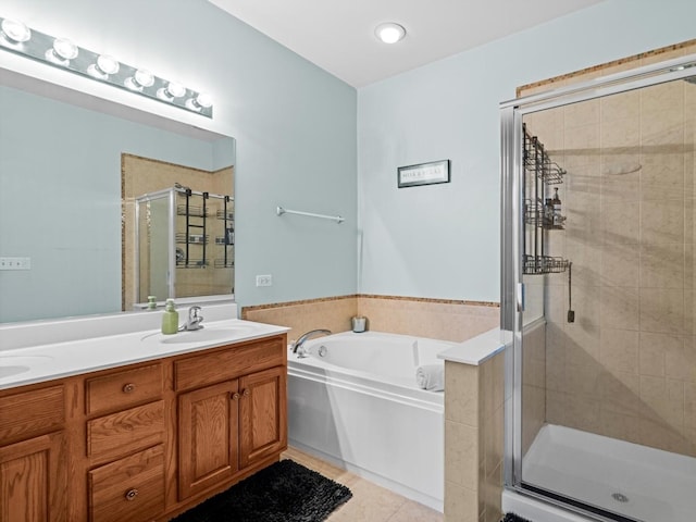 6079 Delaney Dr, Hoffman Estates, IL 60192 - bathroom featuring a stall shower, a garden tub, double vanity, and tile patterned floors