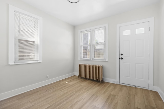 1332 Euclid Ave, Berwyn, IL 60402 - entrance foyer featuring radiator heating unit and light wood-style flooring