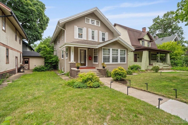 1427 Camp Ave, Rockford, IL 61103 - view of front of home featuring covered porch and a front lawn