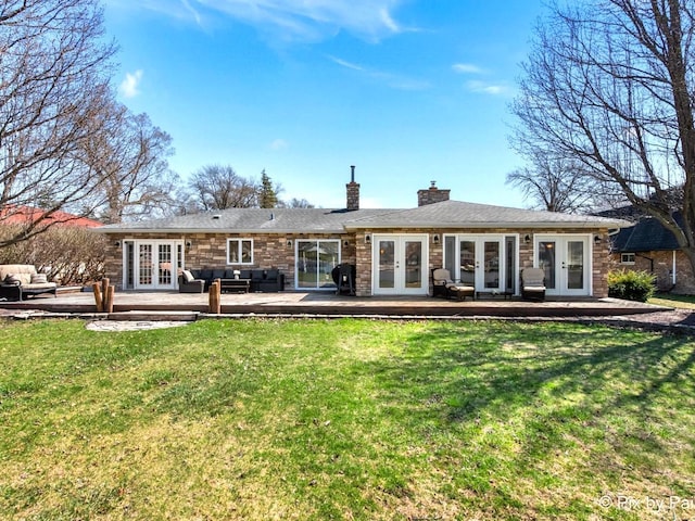 1425 N River Rd, Mchenry, IL 60051 - rear view of property featuring french doors, an outdoor living space, a chimney, and a yard