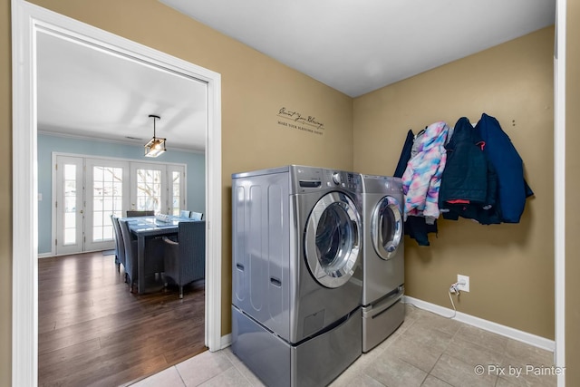 1425 N River Rd, Mchenry, IL 60051 - laundry area with separate washer and dryer, ornamental molding, tile patterned floors, and french doors
