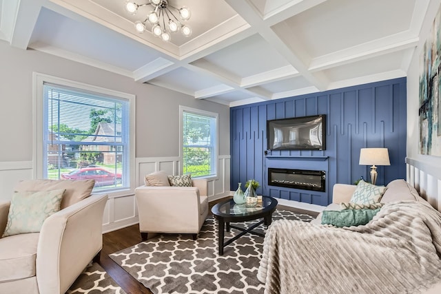 1726 W 106th St, Chicago, IL 60643 - living area featuring coffered ceiling, a decorative wall, dark wood finished floors, a glass covered fireplace, and beamed ceiling