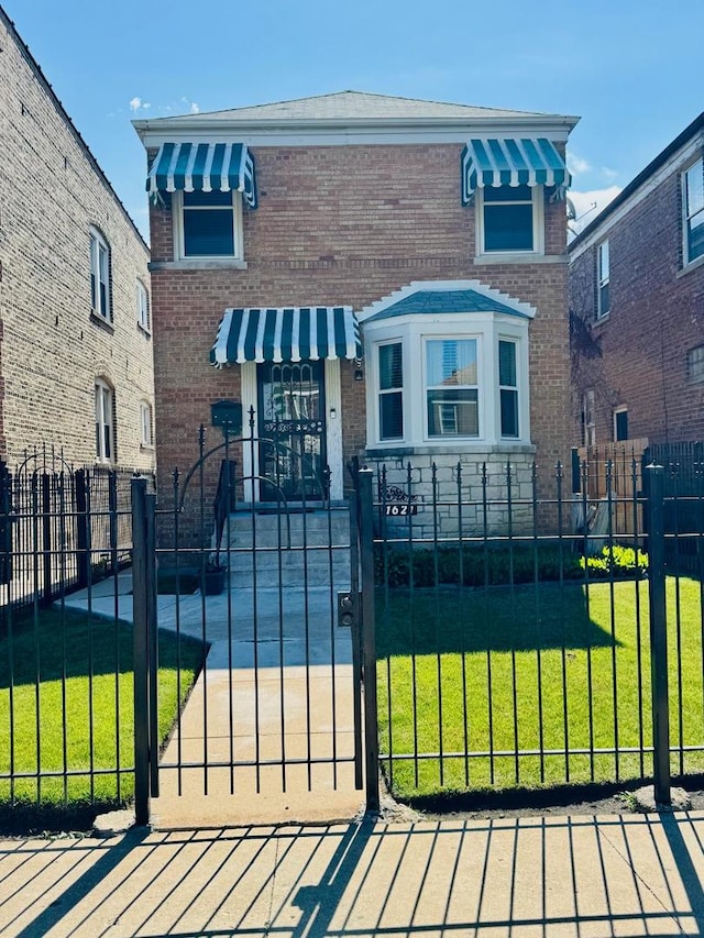 1621 N Luna Ave, Chicago, IL 60639 - view of front of property with brick siding and a fenced front yard