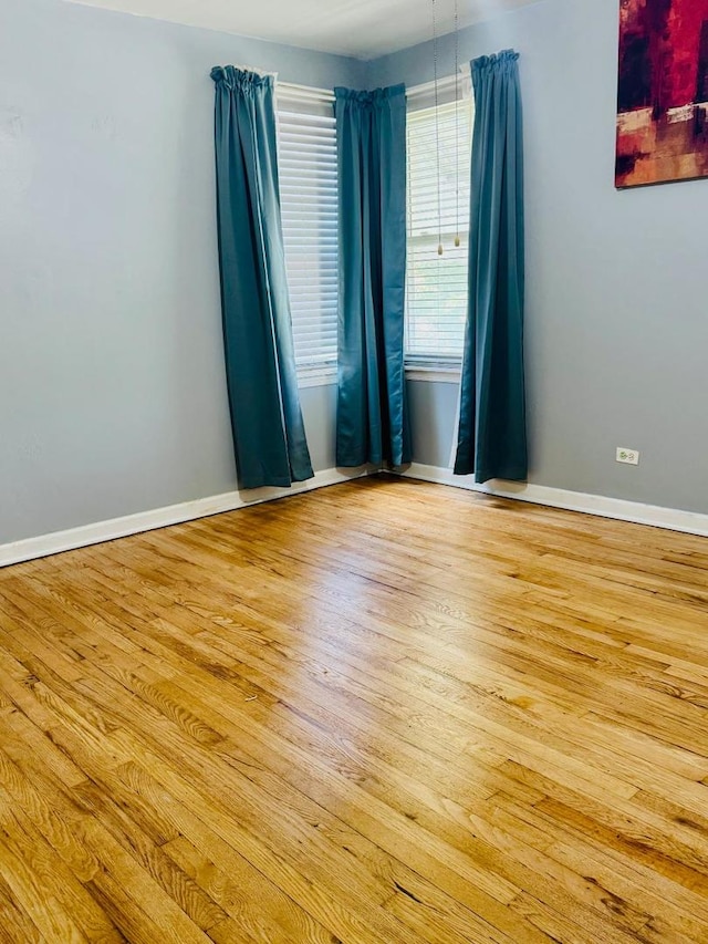 1621 N Luna Ave, Chicago, IL 60639 - spare room featuring wood finished floors and baseboards