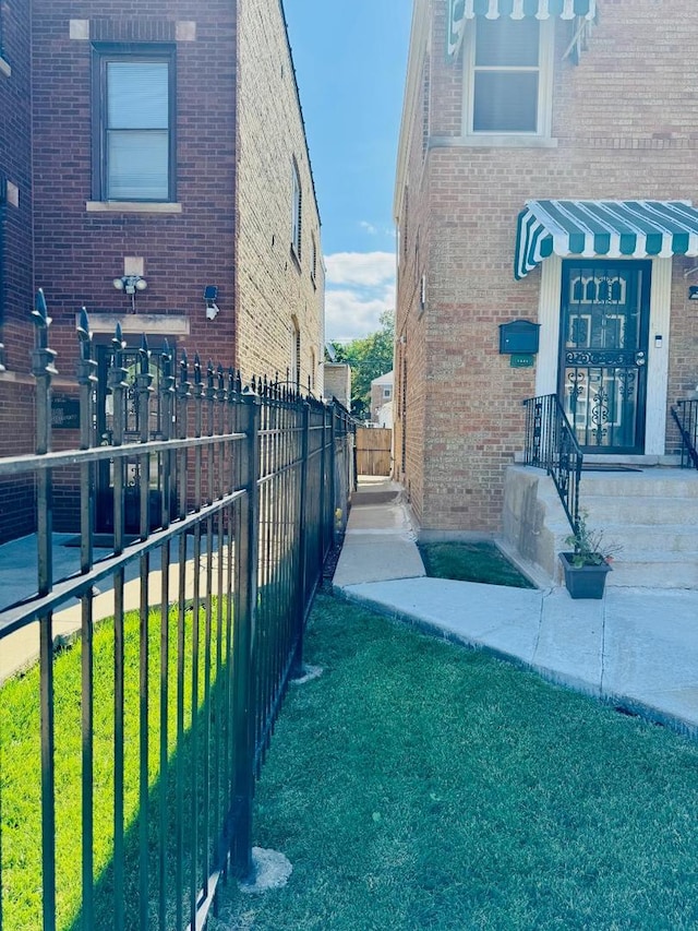 1621 N Luna Ave, Chicago, IL 60639 - view of home's exterior featuring brick siding