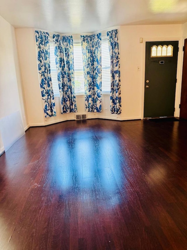 1621 N Luna Ave, Chicago, IL 60639 - unfurnished living room featuring wood finished floors and baseboards