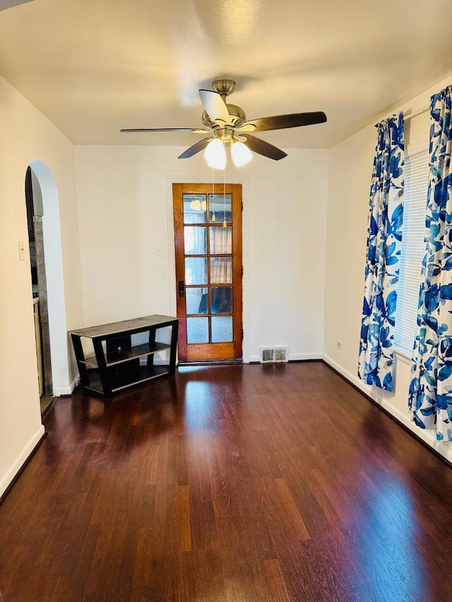 1621 N Luna Ave, Chicago, IL 60639 - spare room with ceiling fan, wood finished floors, and arched walkways