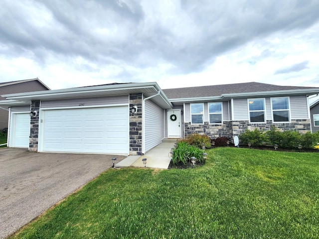 12549 New York St, Loves Park, IL 61111 - ranch-style house featuring a garage, stone siding, driveway, and a front lawn
