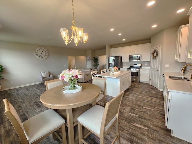 12549 New York St, Loves Park, IL 61111 - dining space featuring a chandelier, dark wood-type flooring, and recessed lighting