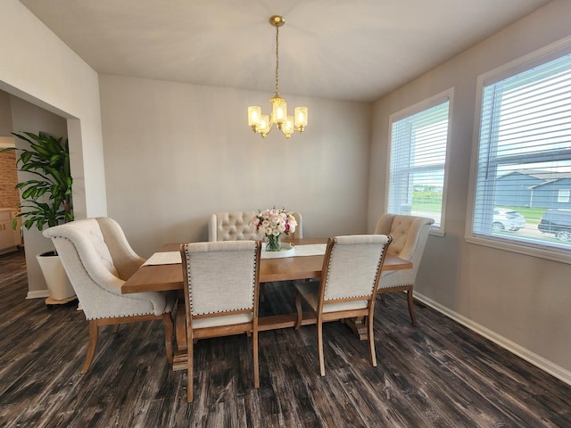 12549 New York St, Loves Park, IL 61111 - dining space featuring a chandelier, dark wood finished floors, and plenty of natural light