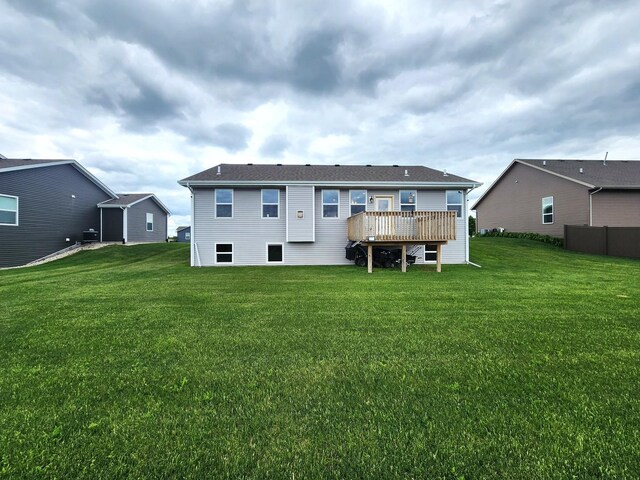 12549 New York St, Loves Park, IL 61111 - back of house featuring a yard and a wooden deck
