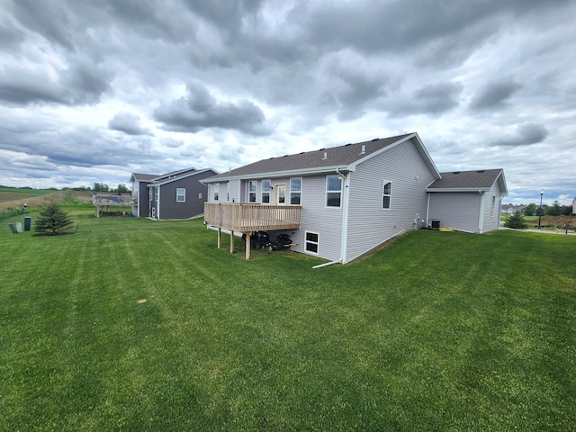 12549 New York St, Loves Park, IL 61111 - rear view of property featuring a deck and a yard