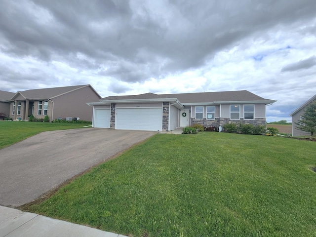 12549 New York St, Loves Park, IL 61111 - single story home with stone siding, an attached garage, driveway, and a front yard