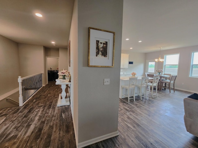 12549 New York St, Loves Park, IL 61111 - hall with dark wood-type flooring, a chandelier, an upstairs landing, and recessed lighting