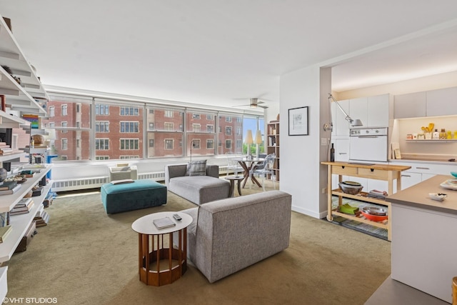 3900 N Lake Shore Dr Unit 7C, Chicago, IL 60613 - living area with light carpet, ceiling fan, and radiator