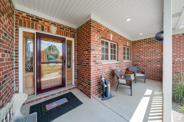 990 Fox Trail Ln, Somonauk, IL 60552 - doorway to property featuring brick siding and a porch