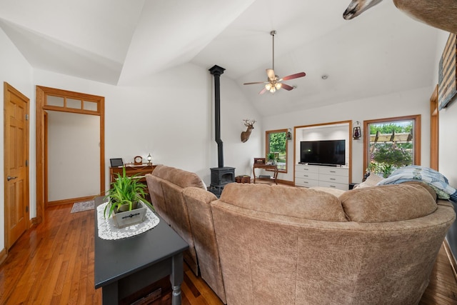990 Fox Trail Ln, Somonauk, IL 60552 - living area with a wood stove, lofted ceiling, a ceiling fan, and wood finished floors