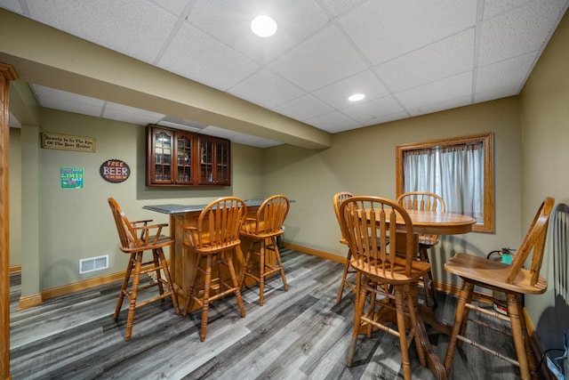 990 Fox Trail Ln, Somonauk, IL 60552 - dining area featuring a paneled ceiling, a dry bar, wood finished floors, and recessed lighting