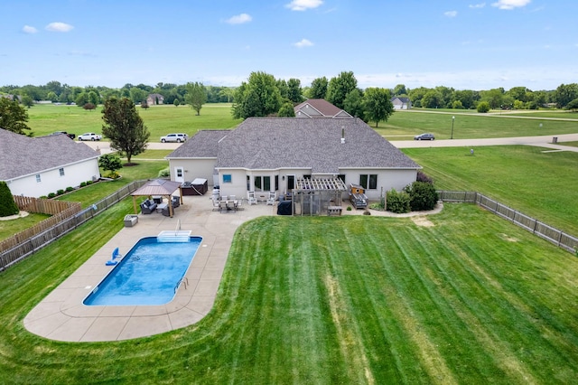 990 Fox Trail Ln, Somonauk, IL 60552 - rear view of house with a fenced backyard, a patio area, outdoor dining area, and a gazebo