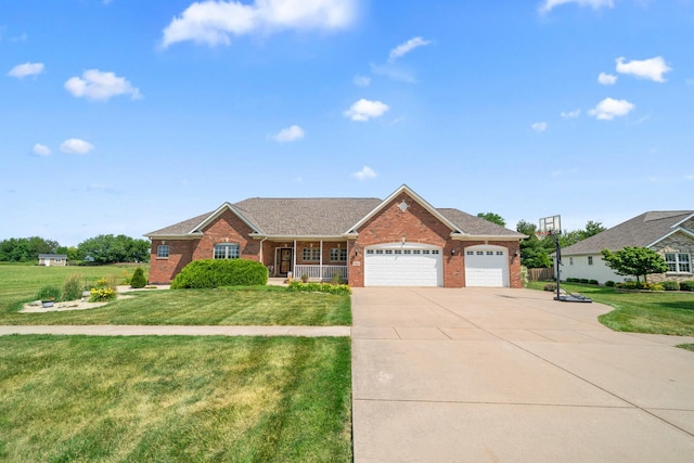 990 Fox Trail Ln, Somonauk, IL 60552 - single story home featuring a garage, brick siding, a front yard, concrete driveway, and covered porch