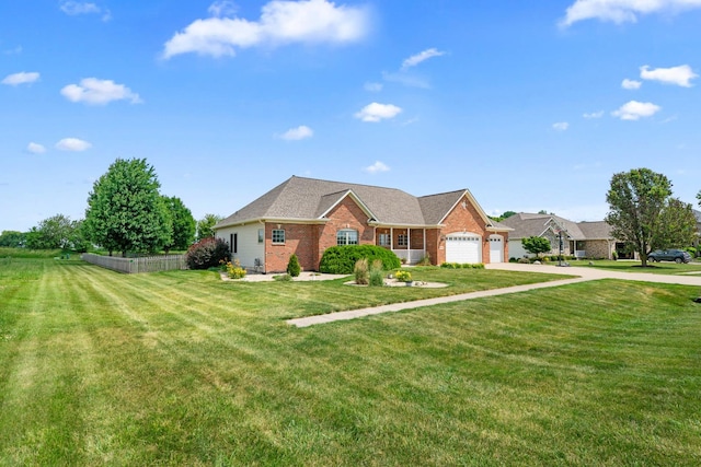 990 Fox Trail Ln, Somonauk, IL 60552 - ranch-style house featuring brick siding, concrete driveway, a front lawn, and an attached garage
