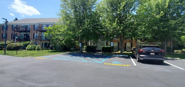 5100 Carriageway Dr Unit 305-2, Rolling Meadows, IL 60008 - view of building exterior with uncovered parking