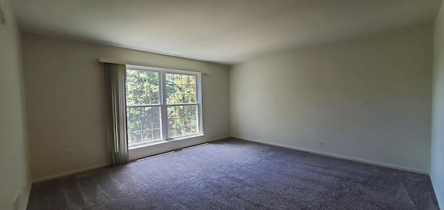 5100 Carriageway Dr Unit 305-2, Rolling Meadows, IL 60008 - empty room featuring dark carpet and baseboards