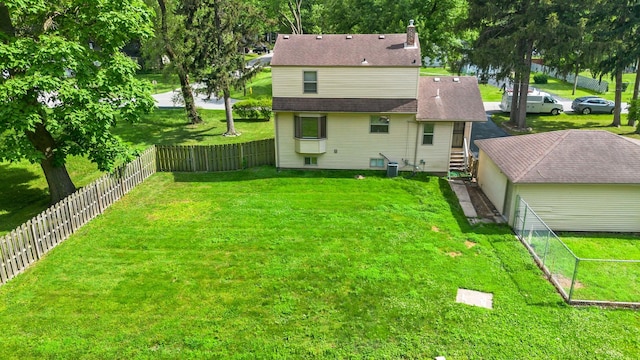 3304 W 160th St, Markham, IL 60428 - rear view of property featuring a fenced backyard, roof with shingles, and a chimney