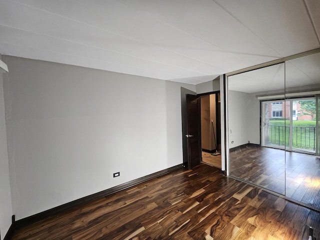 520 Burning Tree Ln Unit 111, Naperville, IL 60563 - unfurnished bedroom featuring access to exterior and dark wood finished floors