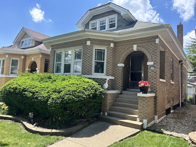 3612 E Ave, Berwyn, IL 60402 - view of front of house with brick siding, entry steps, and a chimney