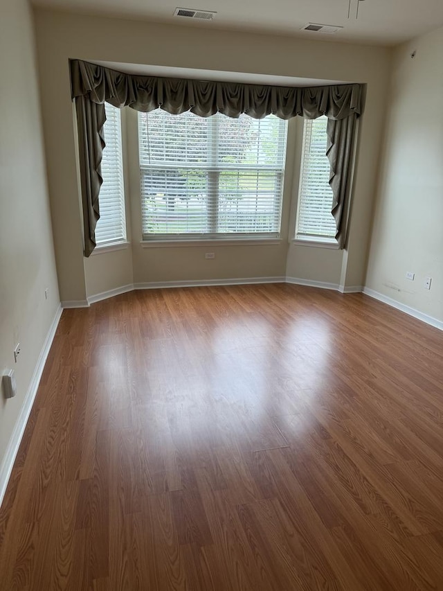 13044 Redstone Dr, Huntley, IL 60142 - empty room with wood finished floors and baseboards