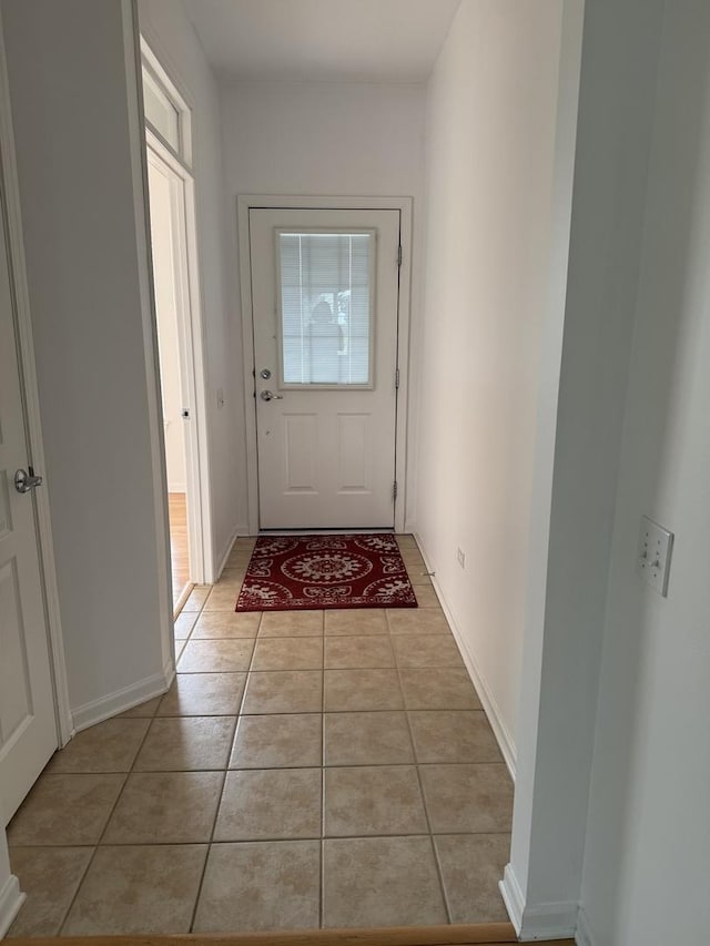 13044 Redstone Dr, Huntley, IL 60142 - entryway featuring light tile patterned flooring and baseboards