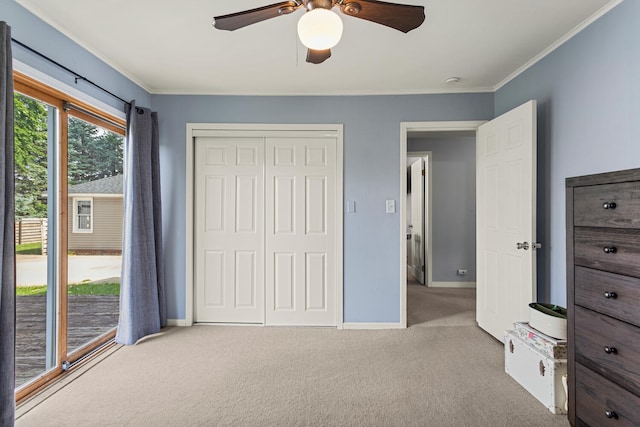 405 N Vorcey St, Tolono, IL 61880 - unfurnished bedroom featuring carpet flooring, ornamental molding, a closet, and a ceiling fan