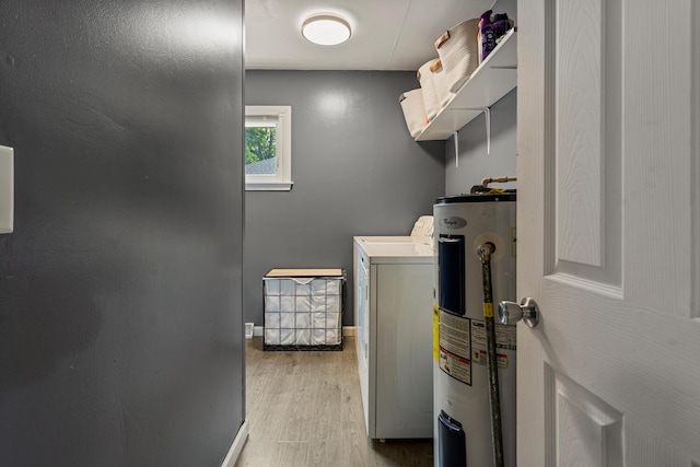405 N Vorcey St, Tolono, IL 61880 - laundry room with washer / dryer, water heater, and light wood-type flooring